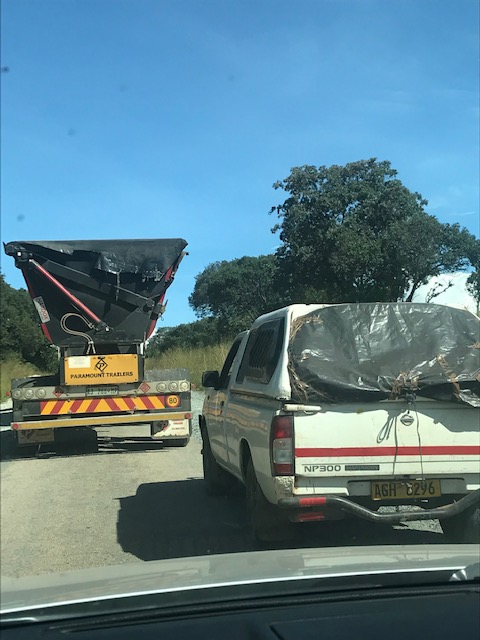 Truck seeks to overtake lorry on road