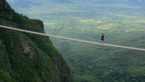 Zella Compton on skywalk way above Zimbabwe Nyanga